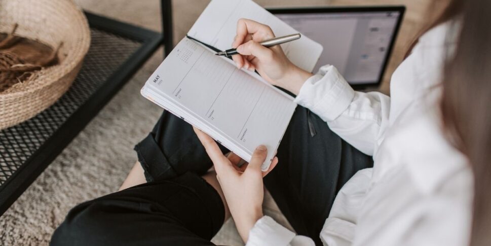 woman holding an agenda