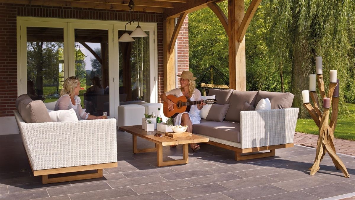backyard patio with two people on outdoor furniture